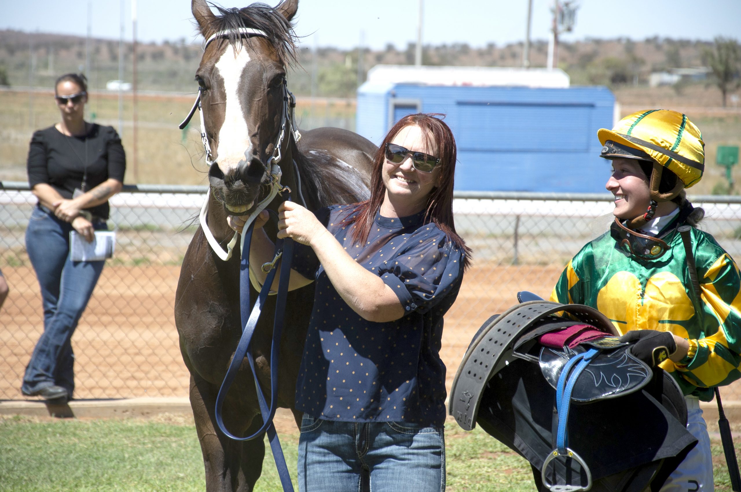 Local trainer Heidi Smith celebrates a win at her home track with jockey Margaret Collett and Meteor’s Man. PICTURE: PATRICK REINCKE